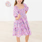 PLAYFUL POSY SMOCKED RUFFLE DRESS