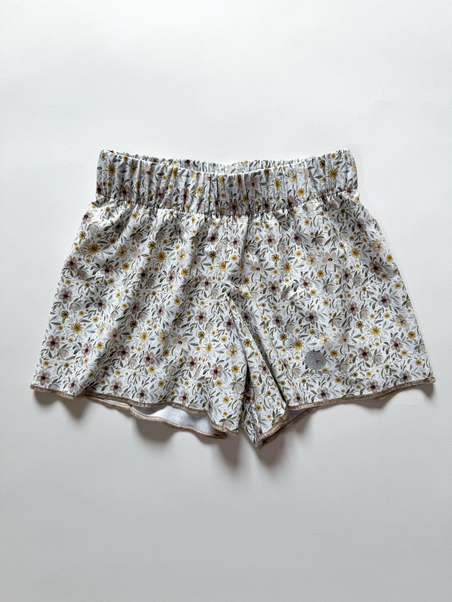 ALMOND FLORAL RUNNER SHORTS